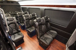 Cozy and inviting interior of a 14-passenger bus in Plano