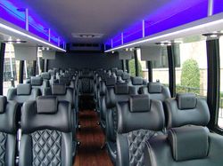 Spacious and well-equipped interior of a 28-passenger bus in Plano