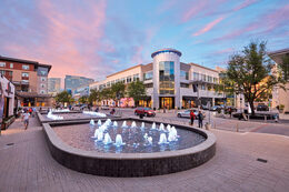 View of Legacy West, a vibrant mixed-use development in Plano, Texas, Luxury Bus Rentals